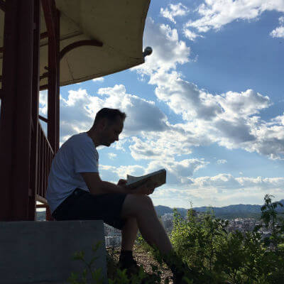 David sitting outside in Chengde learning Chinese