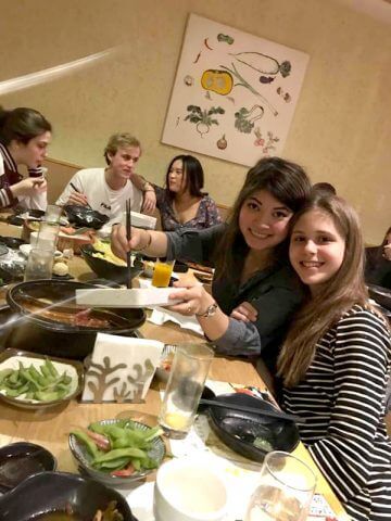 Inge and Fabiola enjoying food