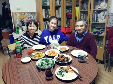 Savannah eating dinner with her Homestay Family in Beijing